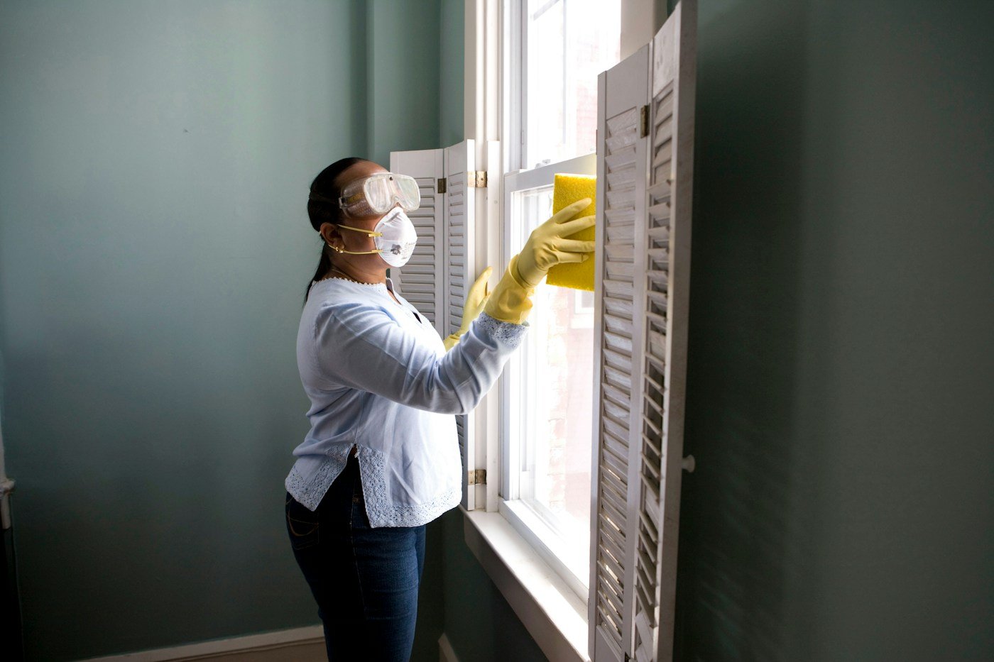 Professional home cleaner caring for a client's home